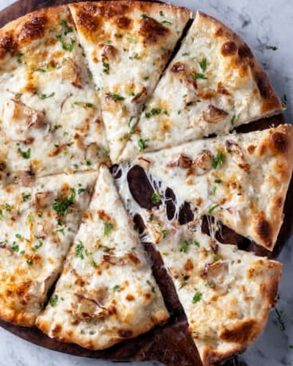 A white pizza sliced into eight pieces is placed on a dark wooden board, set against a white marbled texture background. The pizza has a golden-brown crust with a slightly crispy edge, topped with a smooth layer of melted white cheese that has browned spots, along with small pieces of light brown roasted garlic and some green herb leaves scattered on top. One slice is slightly pulled away, showing stretchy melted cheese strands connecting it to the rest of the pizza. Photo taken with an iphone --ar 4:5 --v 7