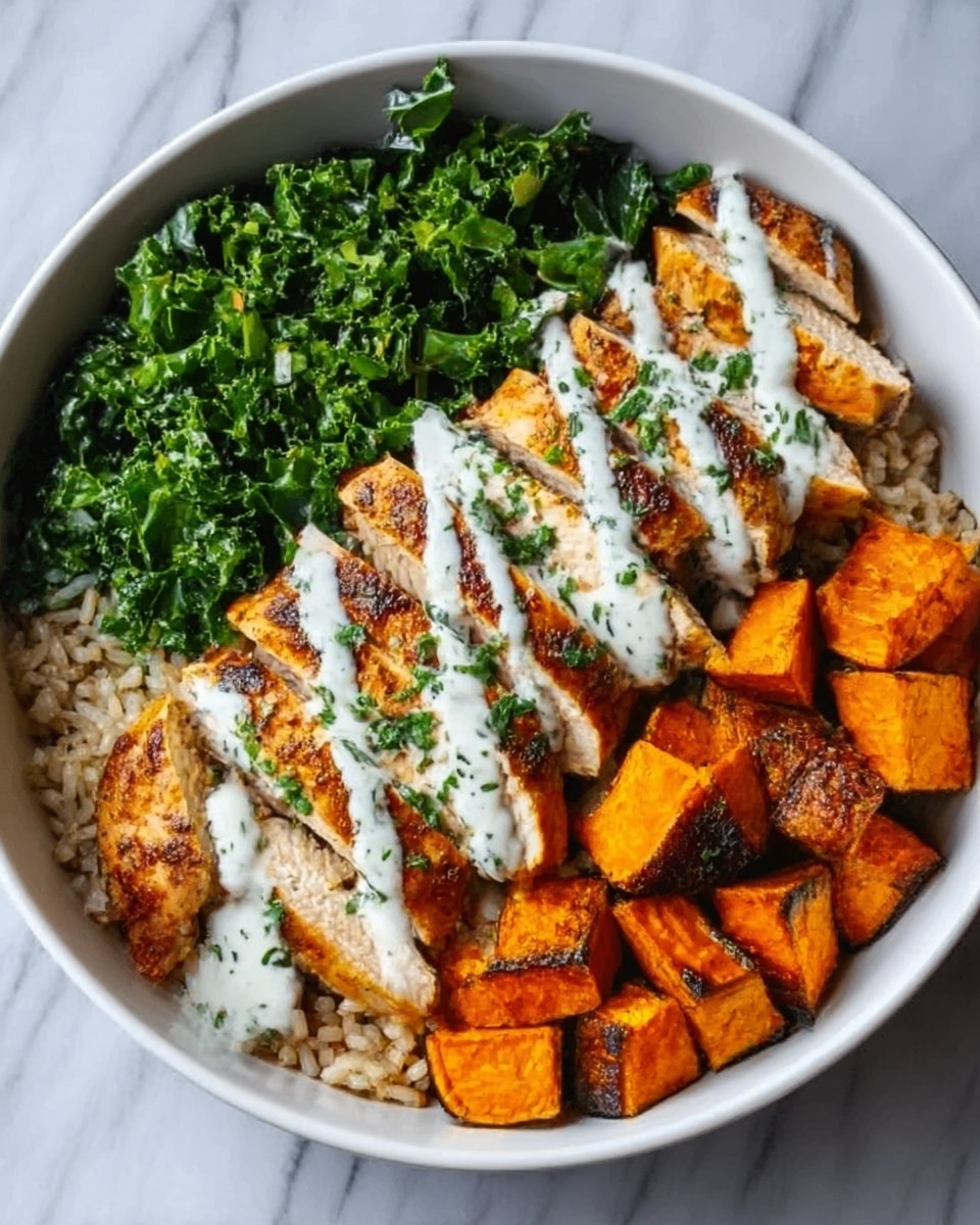 The image shows a white bowl filled with layers of food arranged in a neat way. At the bottom, brown rice forms the base. On one side, grilled chicken slices with a golden-brown color are placed neatly, topped with a drizzle of white yogurt sauce with green herbs. Next to the chicken, a bright green pile of chopped kale adds a fresh look. On the other side, roasted orange sweet potato cubes with a slight char fill the remaining space. The bowl sits on a white marbled surface. Photo taken with an iphone --ar 4:5 --v 7