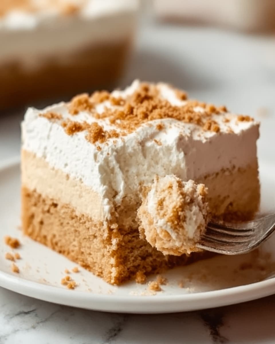 A close-up of a square slice of layered dessert showing three distinct layers on a white plate placed on a white marbled surface. The bottom layer is a moist, light brown cake with a soft and slightly crumbly texture. Above the cake layer, there is a slightly lighter creamy filling that looks smooth and dense. The top layer is a thick, white whipped cream spread evenly, sprinkled with small pieces of crushed brown crumbs. A woman's hand is holding a fork with a bite of the dessert, revealing the moist inside. Photo taken with an iphone --ar 4:5 --v 7