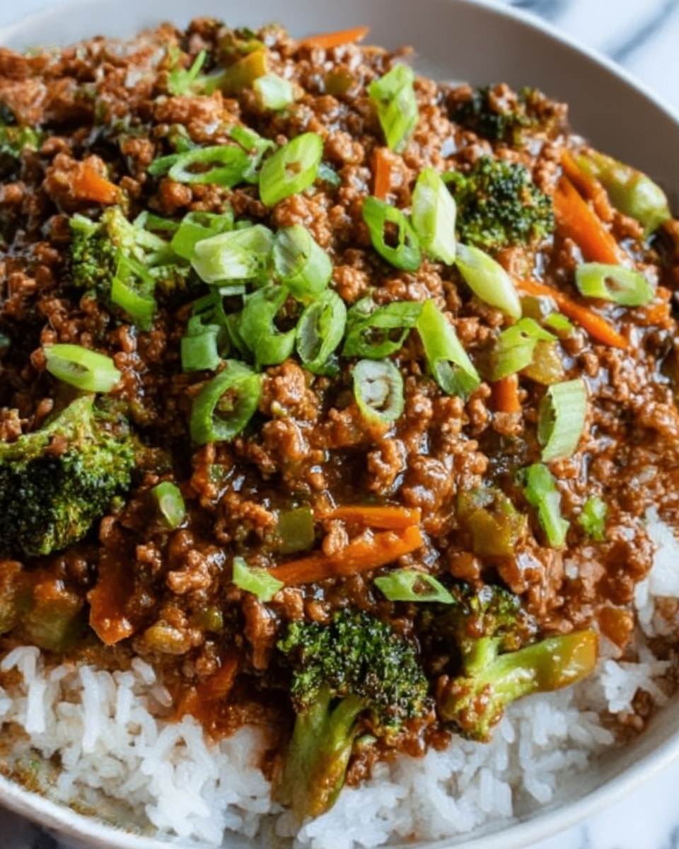 A close-up of a bowl filled with cooked white rice forming the base layer, topped with a thick, brown minced meat sauce mixed with small pieces of bright green broccoli and thin orange carrot strips, all coated in a glossy sauce. The dish is finished with chopped light green spring onions scattered over the top, creating a fresh contrast. The bowl is white and sits on a white marbled surface. The photo is taken with an iphone --ar 4:5 --v 7