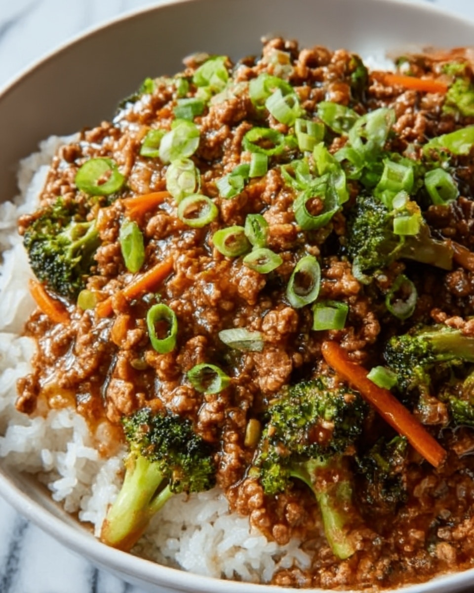 The image shows a close-up of a bowl filled with white rice as the base layer, topped with cooked ground meat mixed with small pieces of broccoli and thin strips of orange carrots. Bright green chopped scallions are sprinkled evenly on top, adding a fresh contrast. The textures show soft rice grains, tender meat, and slightly crisp vegetables. The bowl is white, placed on a white marbled surface. The overall look is colorful and appetizing, with a home-cooked feel. Photo taken with an iphone --ar 4:5 --v 7